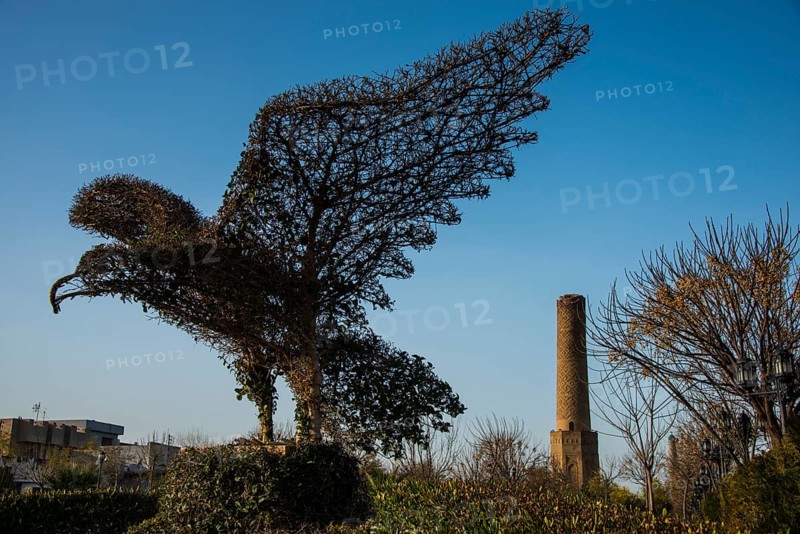 Eagle sculpture in front of Sheik Chooli minaret in Shanadar Park