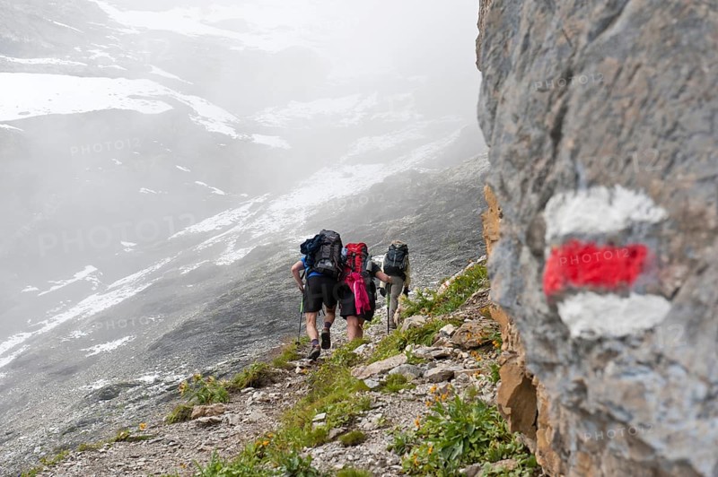 Red and white markings on rocks