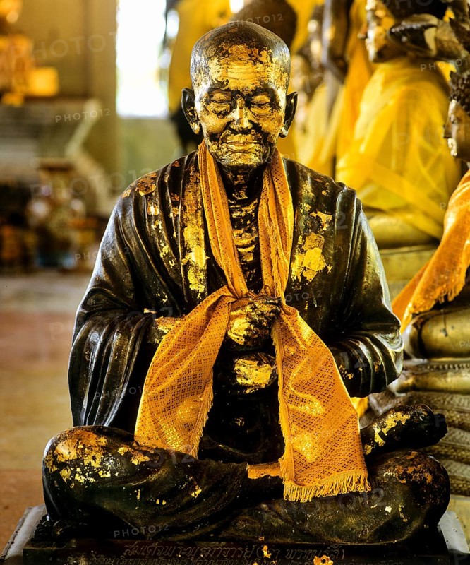 Gilded monk statue in the mountain temple of Wat Phra That Doi Tung