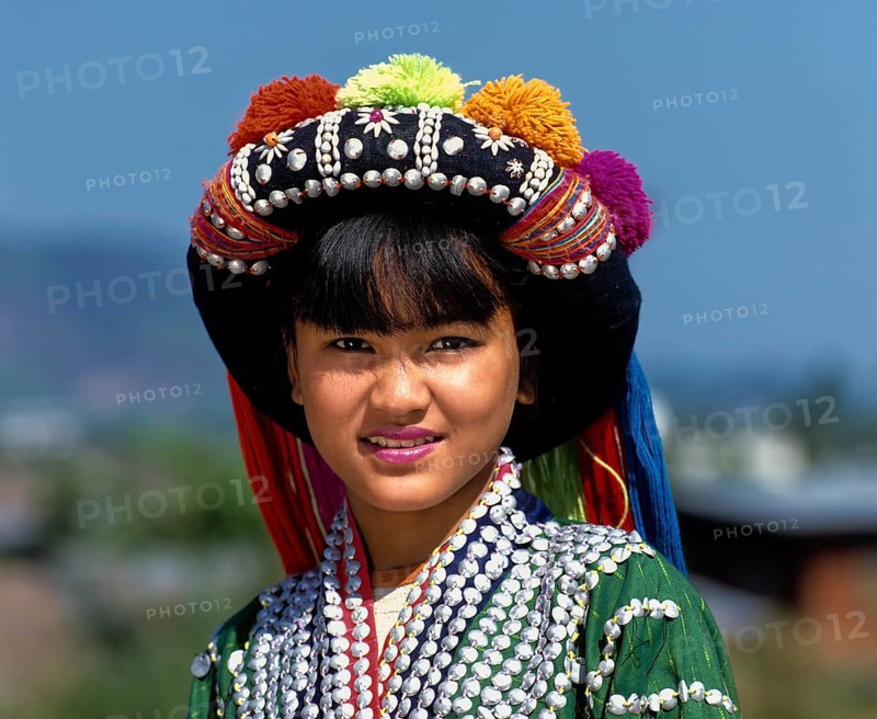 Lisu girl wearing a colourful headdress and the traditional costume of the mountain people