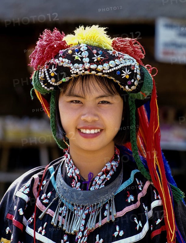 Lisu girl wearing a colourful headdress and the traditional costume of the mountain people