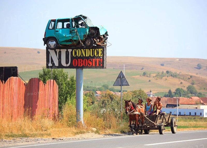 Horse-drawn carriage in traffic