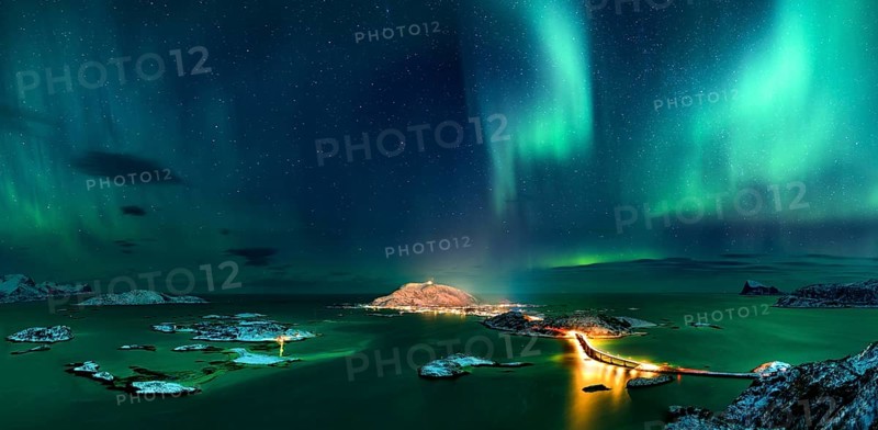 Fjord with islands in winter and the northern lights
