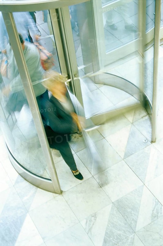 Revolving door with people