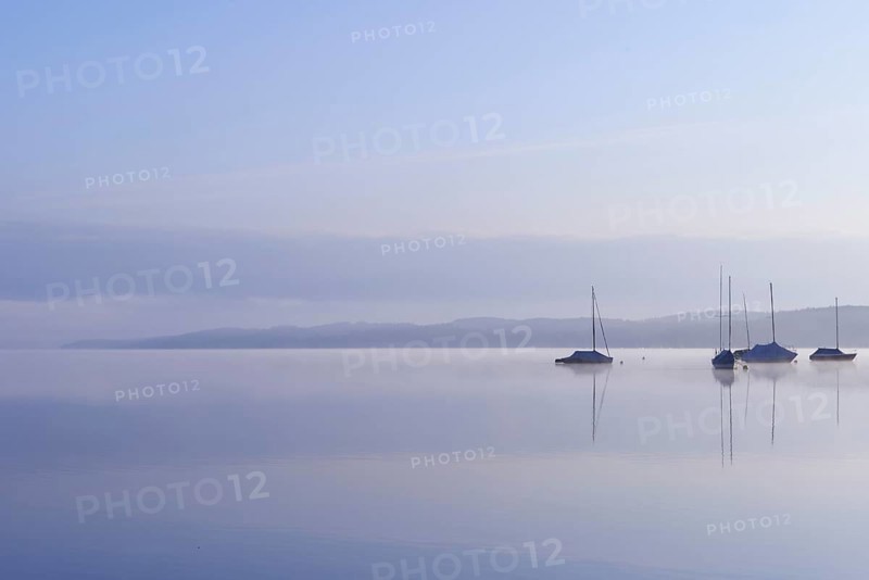 Lake Starnberg with sailing boats in the morning