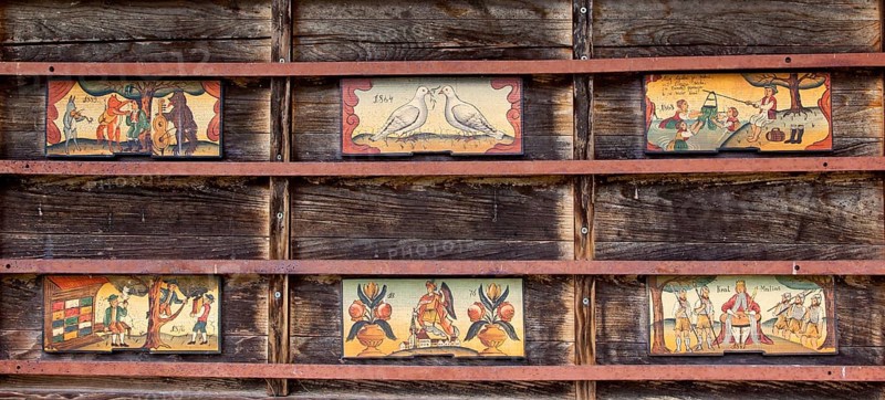 Artistically painted front boards on a beehive