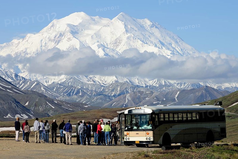 The Wilderness Tour Bus of the Denali National Park and Preserve is stopping at the Stony Hill observation point with views of Mt McKinley