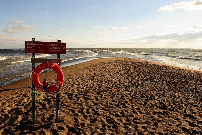 Lifebuoy and warning sign on Canada's southernmost point on Lake Erie