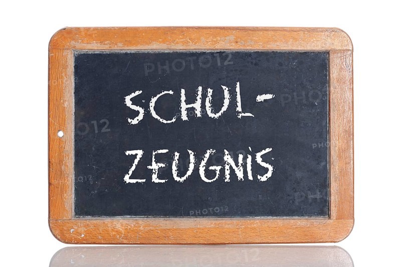 Old slate blackboard with the word "SCHUL-ZEUGNIS"