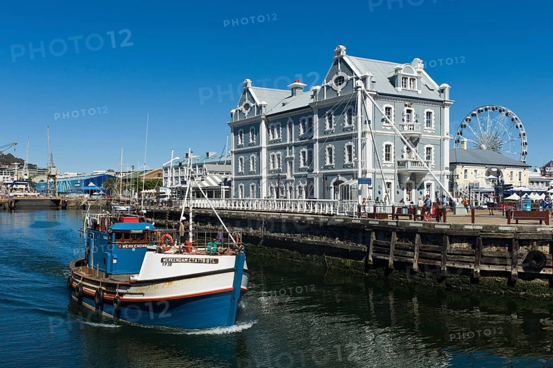 Fishing cutter in front of the African Trading Port building