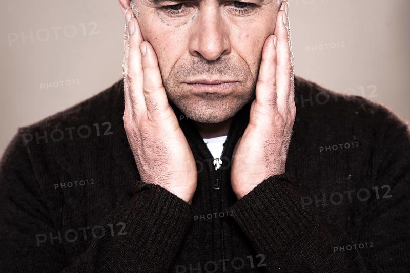 Man with markings for plastic surgery under his eye