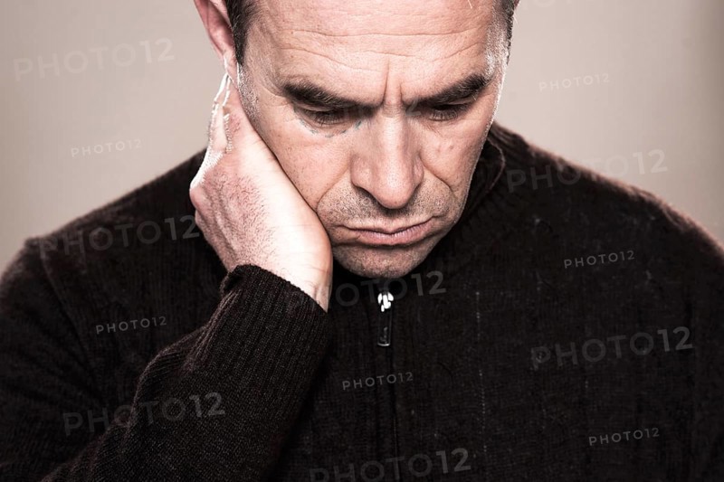Man with markings for plastic surgery under his eye