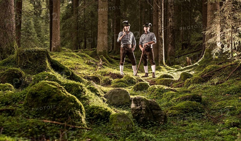 Woodcutters standing in a forest