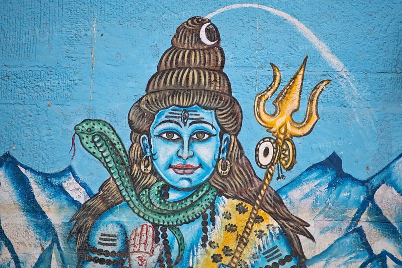 The Hindu god Shiva painted on the wall of a house on the banks of the Ganges River