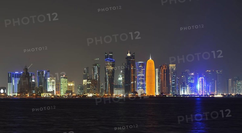 Skyline of Doha at night with the Al Bidda Tower