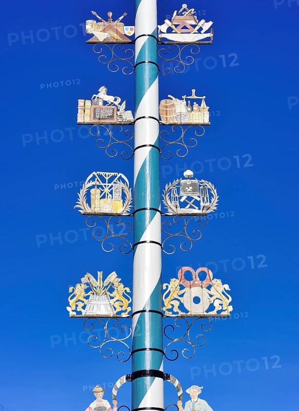 Maypole with wooden signs of local trades