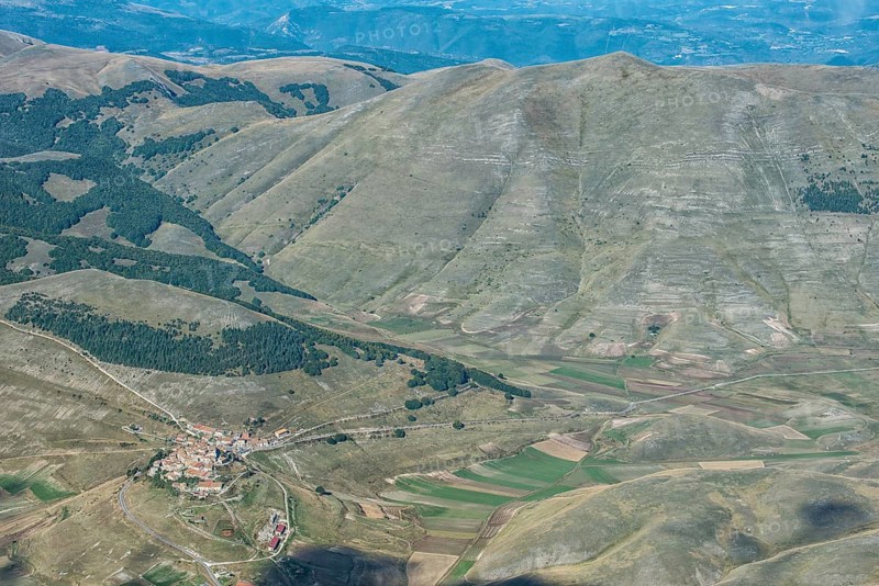 Aerial view of Piano Grande plateau and village of Castelluccio di Norcia