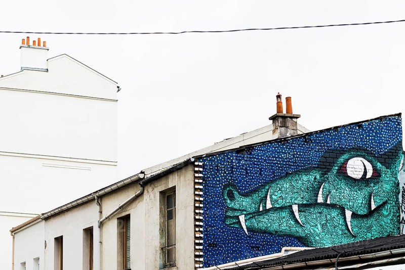 Painted house wall with crocodile figure
