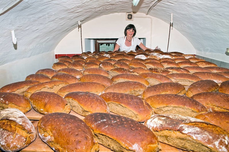 Farmer making bread in her own bakery at the farm