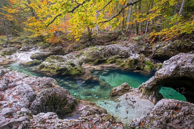 Bizarre rock formations at the mountain stream Mostnica in autumn