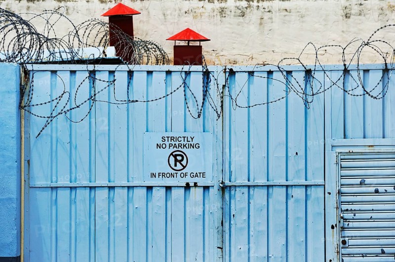 Iron gate with barbed wire