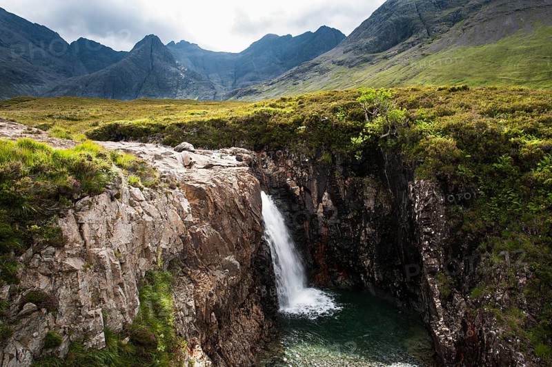 Waterfall at the Fairy Pools in Glen Brittle with Cuillin Hills behind