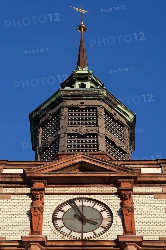Clock tower with insulators of former telegraph poles