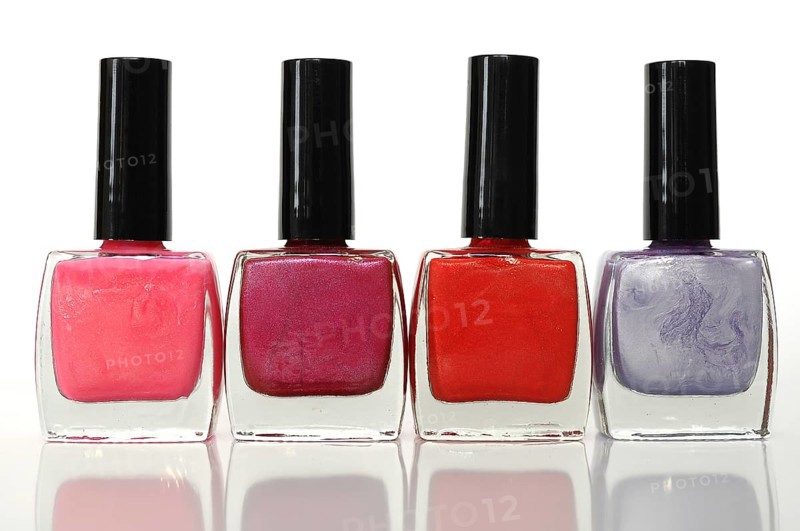 Four nail polish bottles in a row
