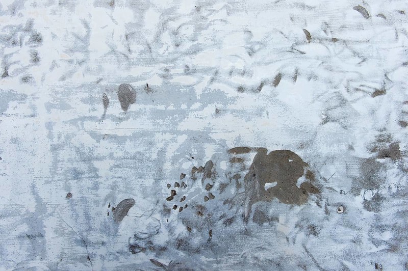 Plastered wall with remnants of paint