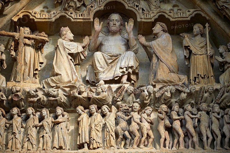 Gothic sculptures on the Tympanum of the central west portal depicting scenes from the Day of Judgement