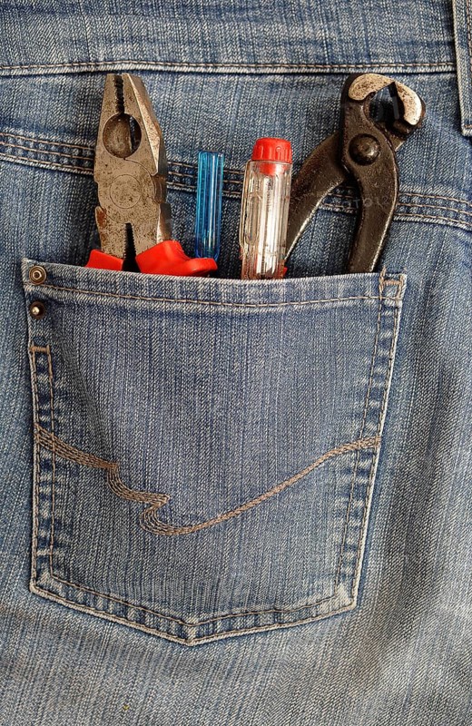 Pliers and screwdrivers in a back pocket