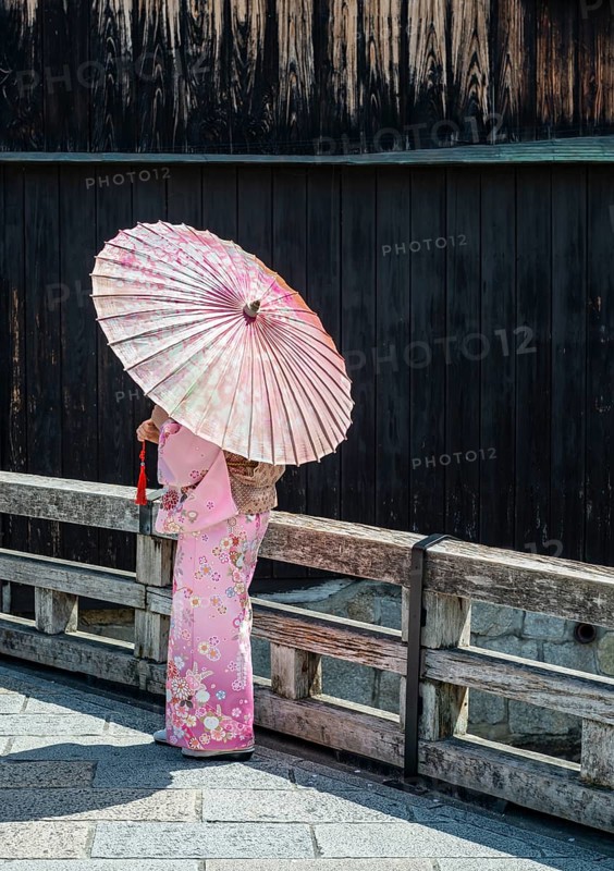 Japanese woman with pink kimono and Japanese parasol