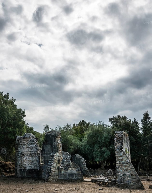 Ruins of the church of Santa Maria di Riscamone against a dramatic sky