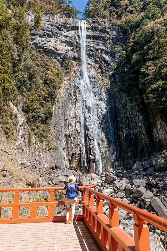 Tourist looks at Nachi Waterfall at Seigantoji Temple