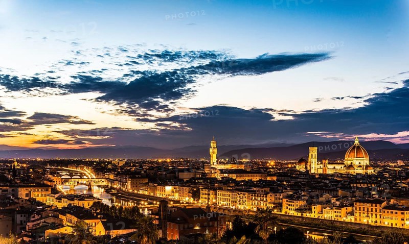 Illuminated city panorama at dusk with Florence Cathedral