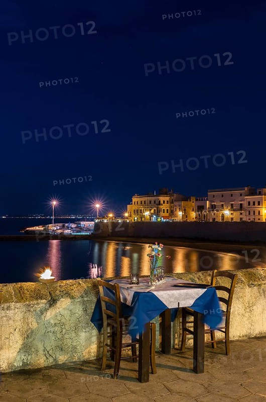 Laid table in restaurant at night