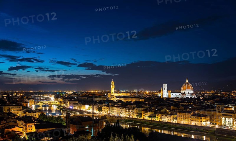 Illuminated city panorama at dusk with Florence Cathedral