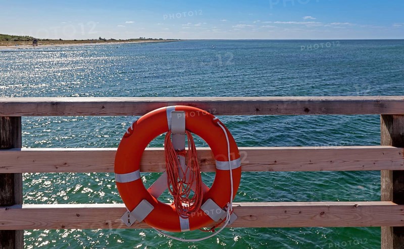 Lifebuoy on a wooden railing