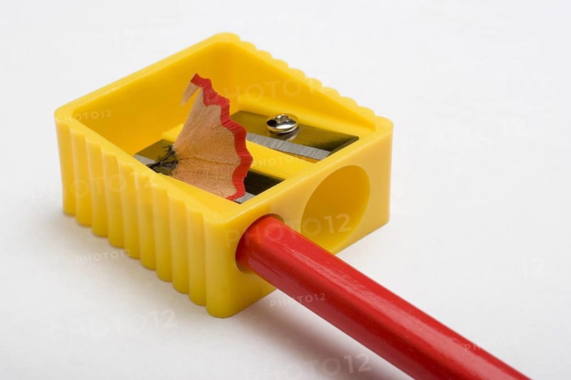 Red pencil and yellow pencil sharpener