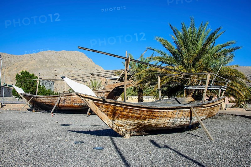 Old dhows in front of Khasab fort