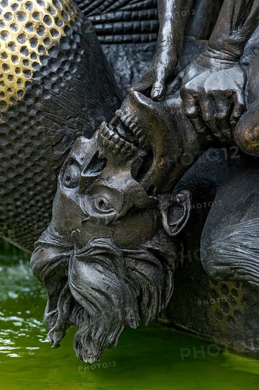 Half-decayed husband fighting with wife statue