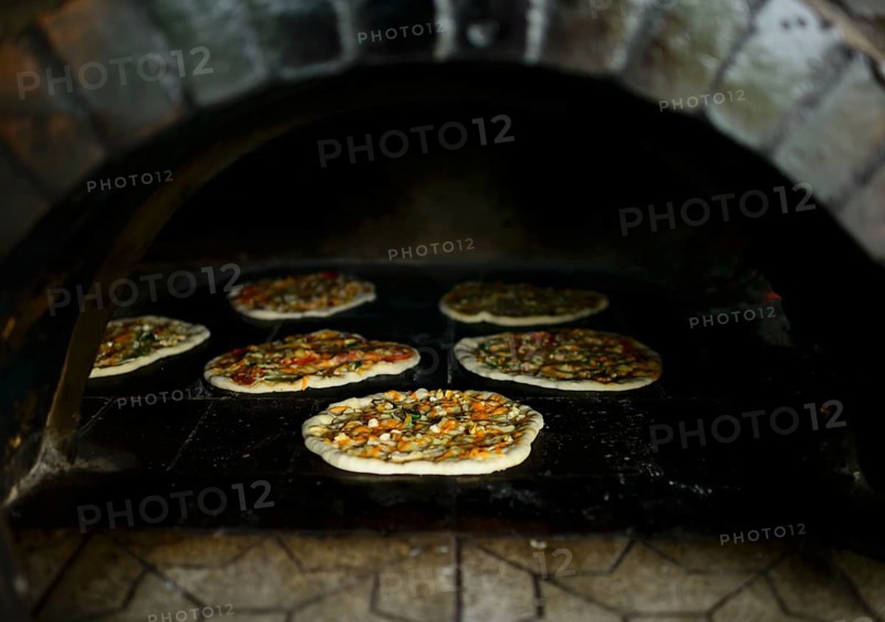 Pizza is baking in a kiln