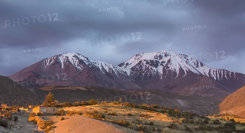The Taapaca volcano in the last evening light
