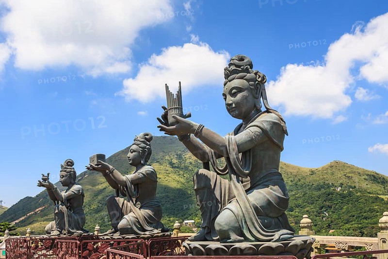Statues of Devas making offerings at Tian Tan Buddha image at Po Lin Monastery