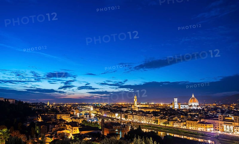Illuminated city panorama at dusk with Florence Cathedral