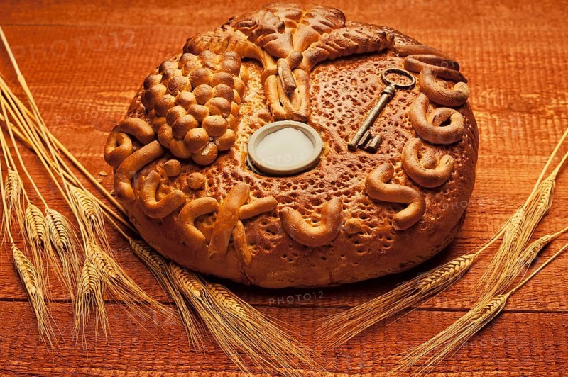 Decorated bread loaf with a key and salt shaker baked into the bread