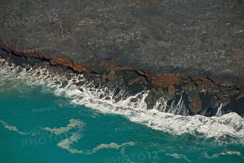 Surf at the foot of Mt Kilauea