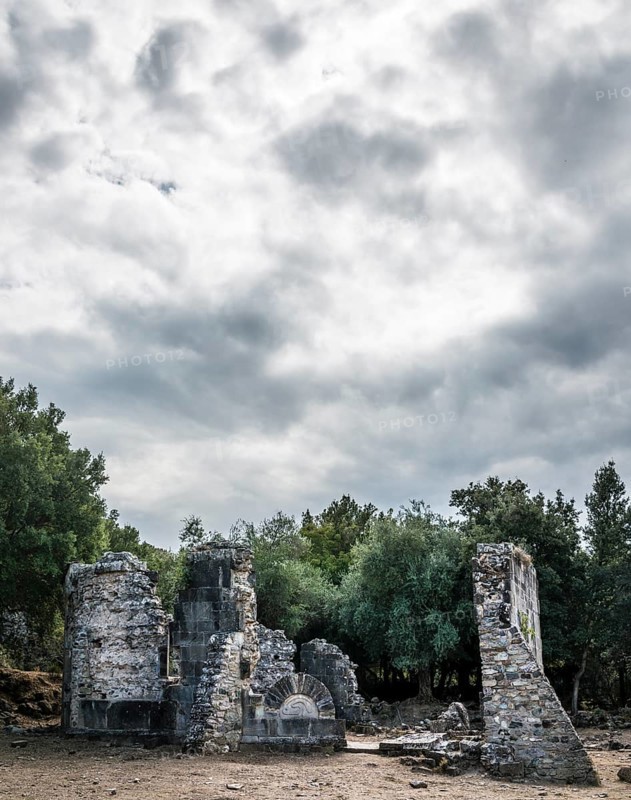 Ruins of the church of Santa Maria di Riscamone against a dramatic sky