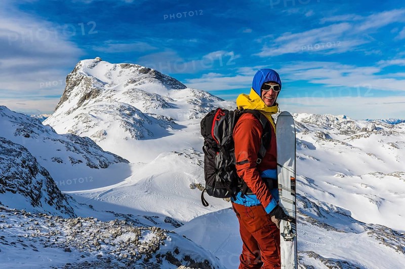 Ski mountaineer in front of the summit of Mt Hochkonig