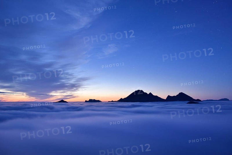 Clouds and mountain peaks